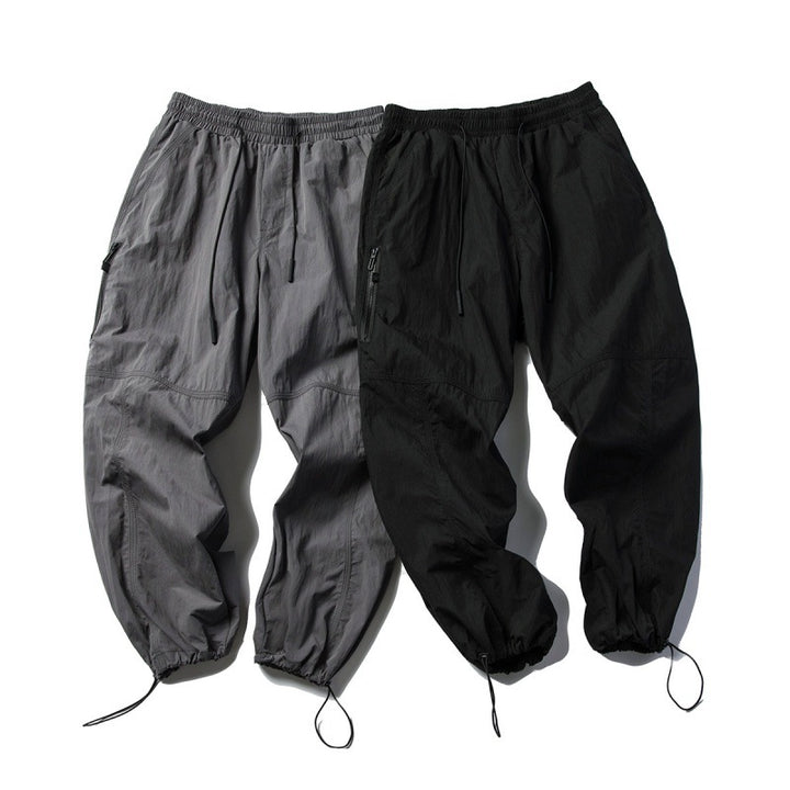 Unisex Technical Cargo Pants in Baggy Cut with Drawstring Waist and Adjustable Leg Closures Mune Fashion