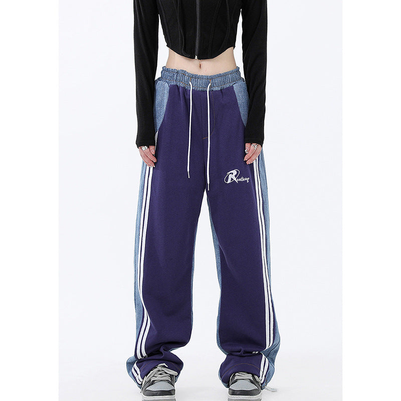 Ladies wide jogging pants with high waist and denim inserts as well as side stripes Mune Fashion