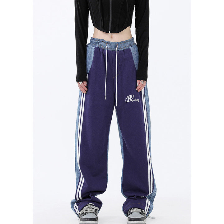 Ladies wide jogging pants with high waist and denim inserts as well as side stripes Mune Fashion