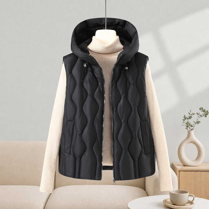Women longer cut quilted vest with hood, wave quilting and detachable zipper Mune Fashion