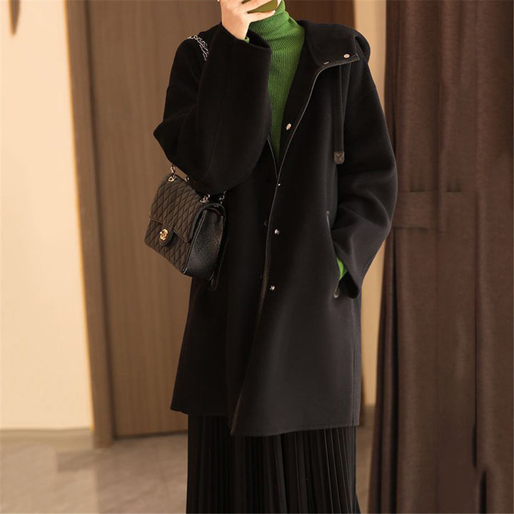 Women's mid-length wool blend coat with hood and snap button placket in oversized fit Mune Fashion