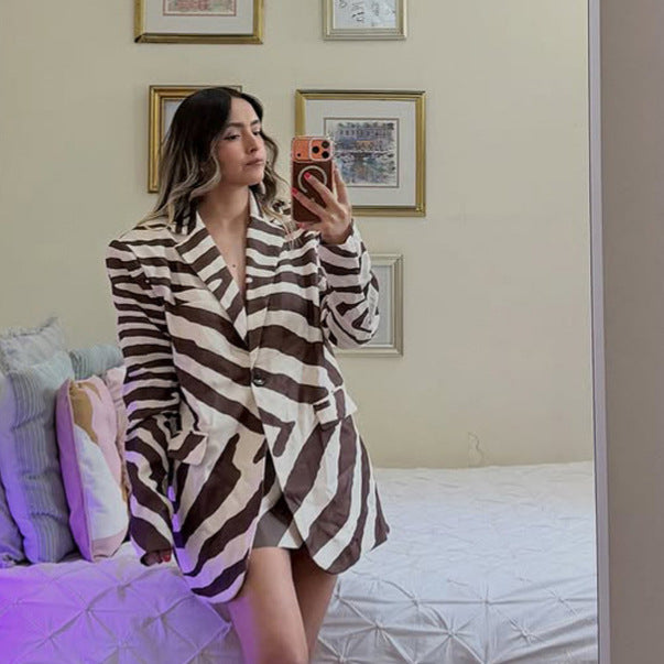 Women’s blazer dress in zebra print with prominent shoulder area & wide waist belt Mune Fashion