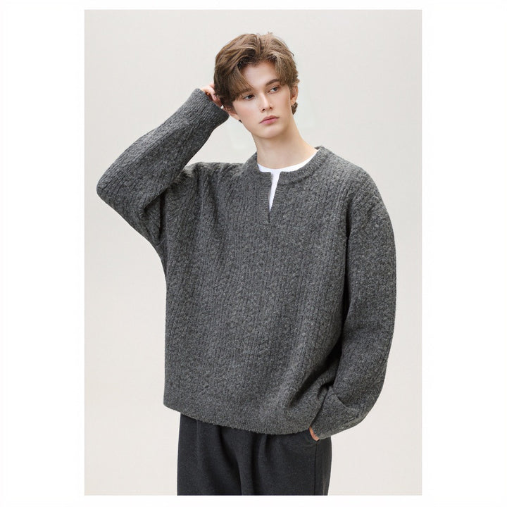 Women's chunky knitted cable pattern sweater with V-neck and layered look Mune Fashion