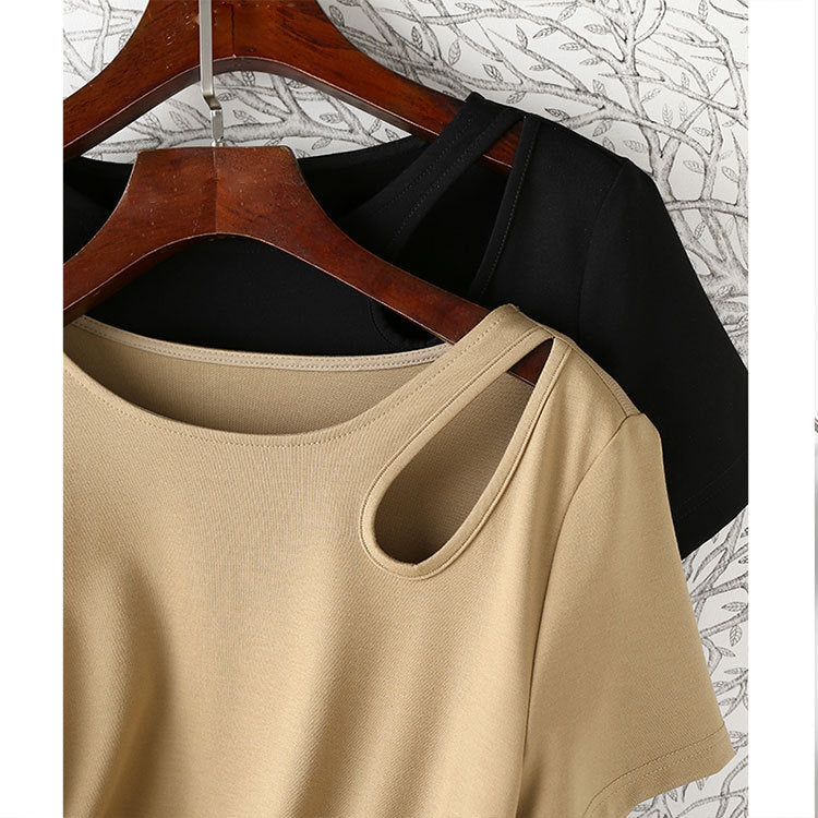 Women's maxi dress with asymmetric cut-out, side gathering, and flowing A-line.