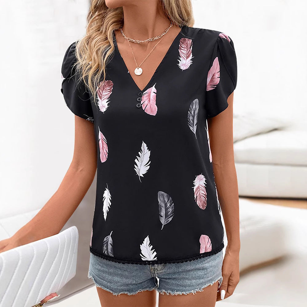 Women's short blouse in lightweight viscose look with feather motif, V-neck, decorative button placket, and puff sleeves Mune Fashion