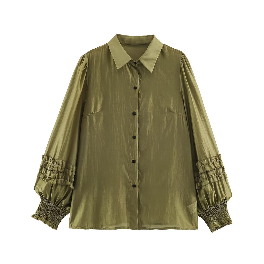 Women's silk effect blouse with voluminous sleeves, layered ruffles, and smocked cuffs