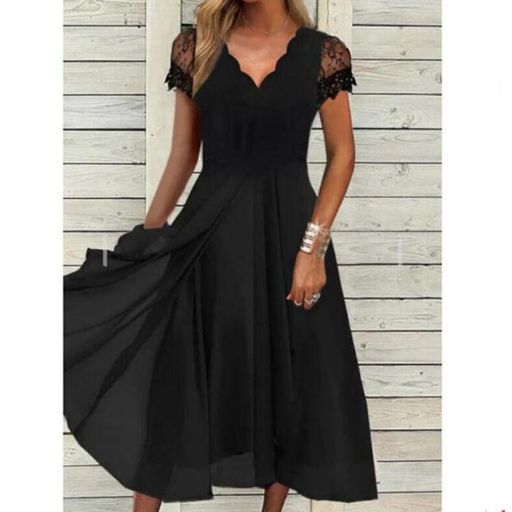 Ladies flowing midi dress with curved V-neck, fitted A-line silhouette, and delicate lace sleeves Mune Fashion