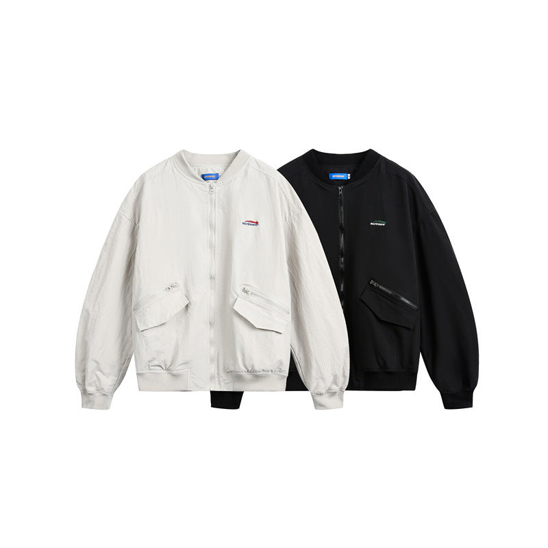 Unisex short cut lightweight nylon bomber jacket with utility pockets and ribbed hem Mune Fashion
