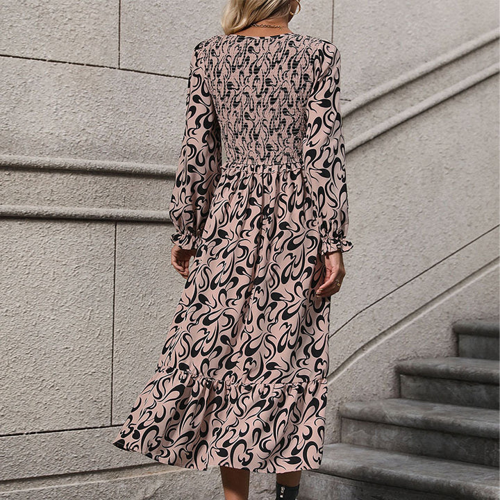 Women’s midi dress with elastic smock top, abstract all-over print and flared ruffle hem Mune Fashion