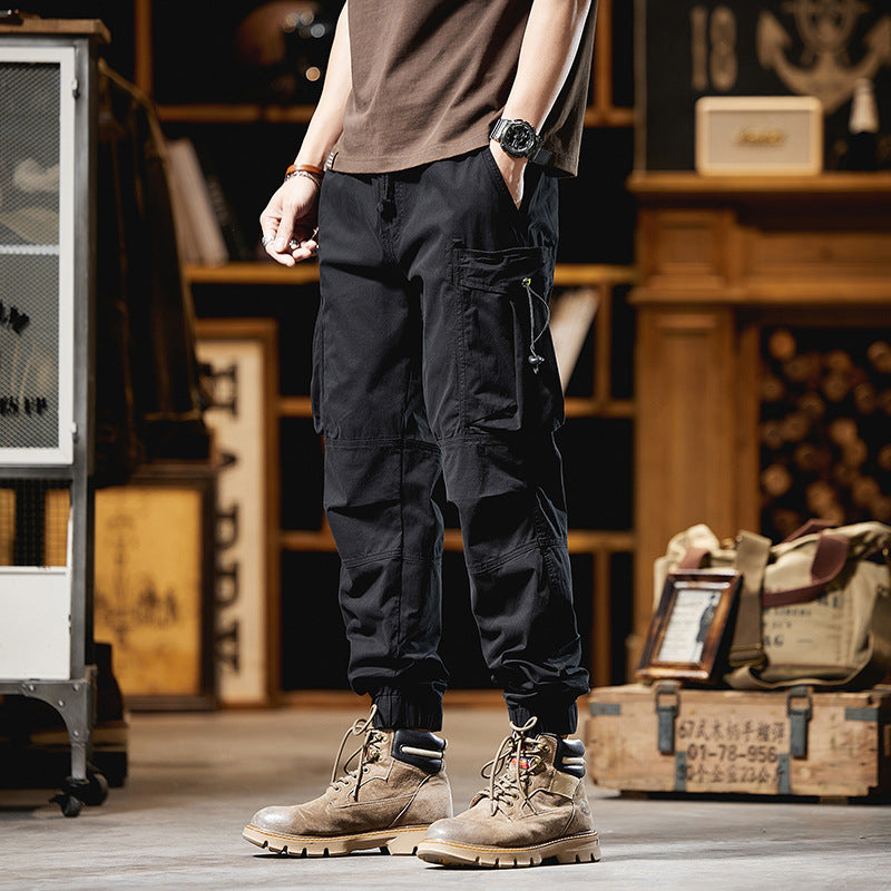 Men's military-inspired cargo pants with elastic tunnel drawstring waistband, flap and zipper pockets Mune Fashion