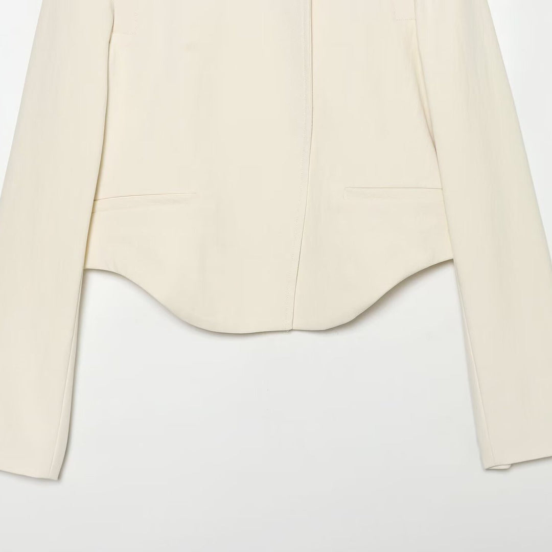 Ladies short blazer with stand-up collar, asymmetrical hem and seam pockets Mune Fashion
