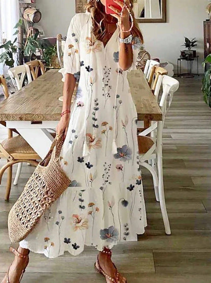 Women’s airy maxi dress in A-line with V-neck, casual rolled sleeves and floral all-over print Mune Fashion