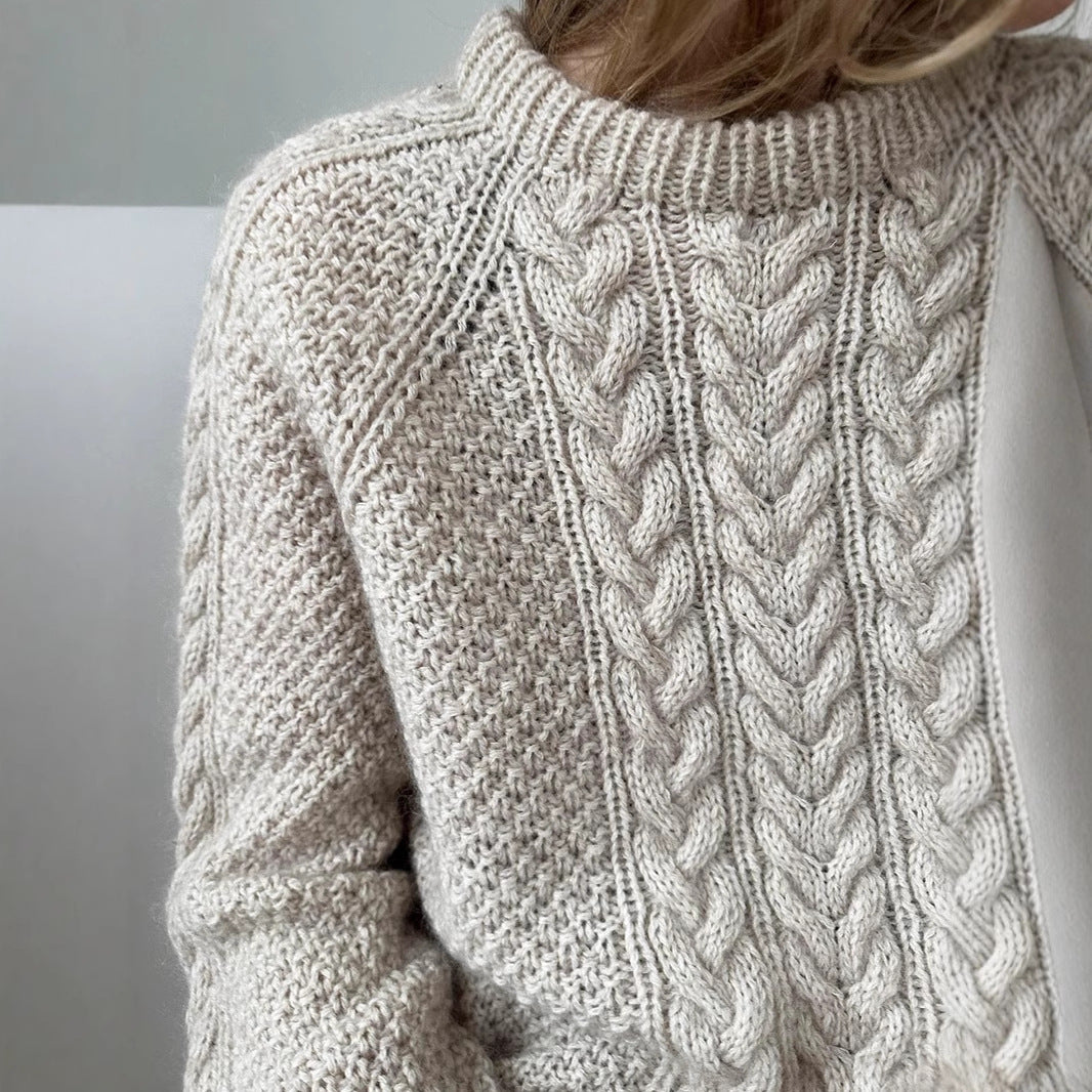 Women's oversized knitted sweater with cable pattern