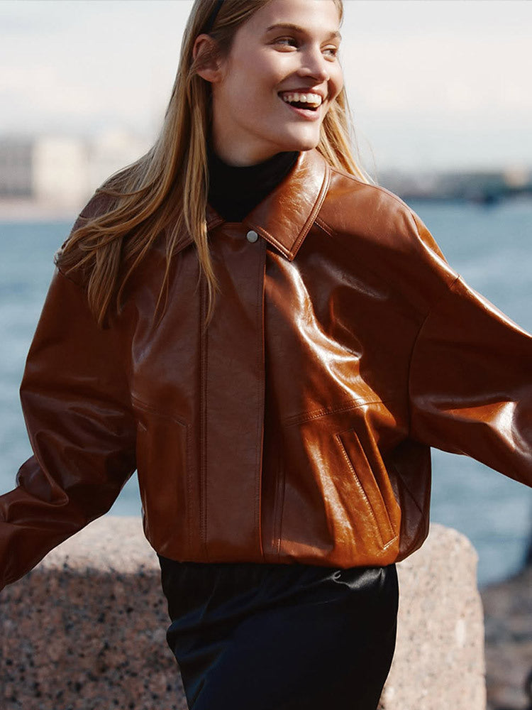 Women's short blazer made of vegan smooth leather with boxy silhouette and concealed snap button placket Mune Fashion