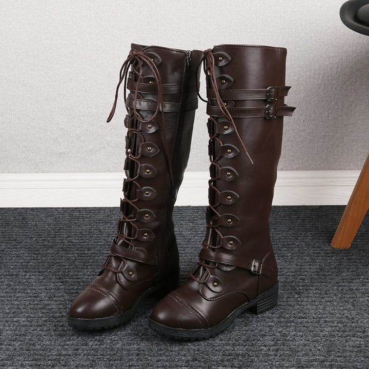 Women knee-high lace-up boots with side zipper, adjustable decorative straps and patterned rubber sole Mune Fashion