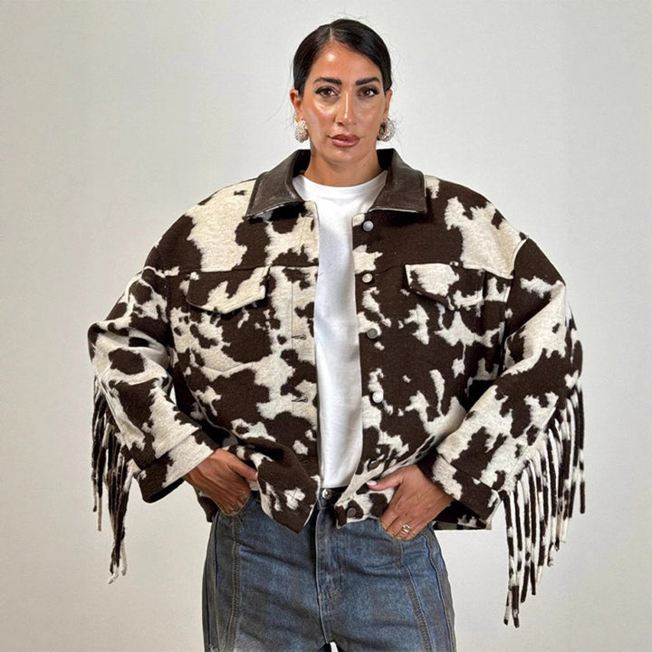 Ladies short jacket in cow print with fringes, faux fur look and leather collar Mune Fashion