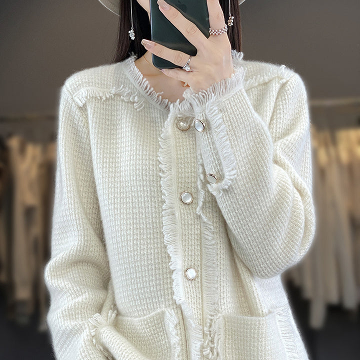 Women's knitted cardigan with fringe trim, mother-of-pearl button placket, and patch pockets Mune Fashion
