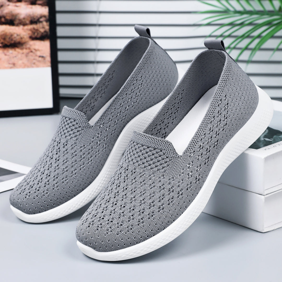 Women’s seamless knit slip-on with perforated air mesh structure, ergonomic memory footbed, and lightweight EVA cushioning Mune Fashion