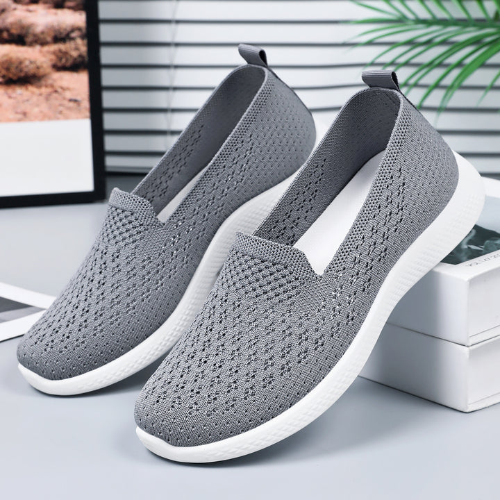 Women’s seamless knit slip-on with perforated air mesh structure, ergonomic memory footbed, and lightweight EVA cushioning Mune Fashion