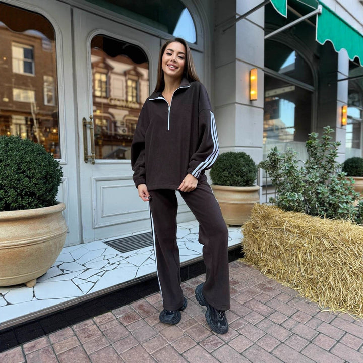 Women's casual high neck half zip tracksuit with distinctive side stripes, oversized hood and loose jogger pants Mune Fashion