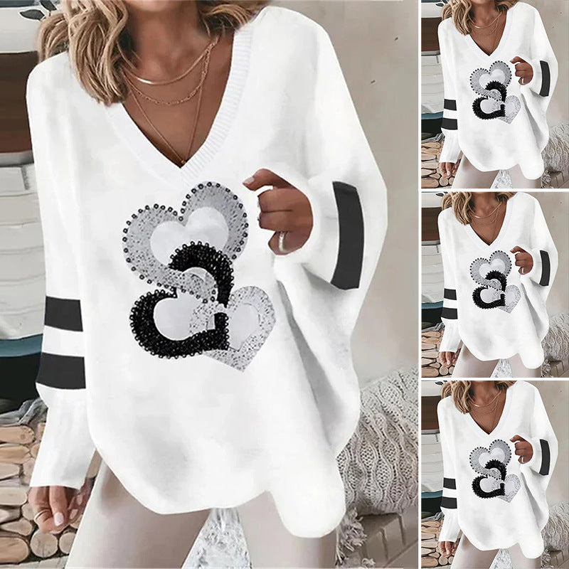 Women's oversized knitted sweater with deep neckline sequin heart and contrast sleeve stripes Mune Fashion