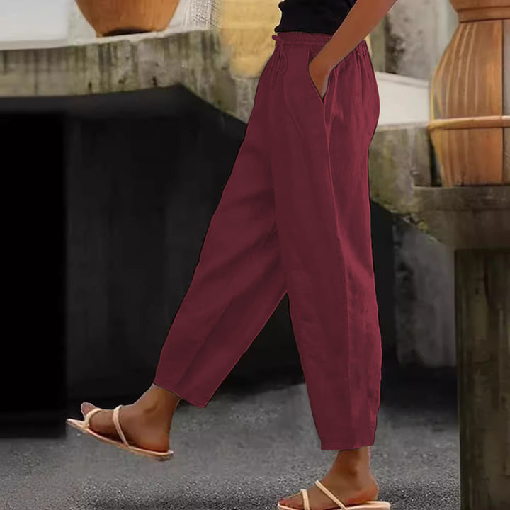 Women's loose-fitting linen blend pants with elastic waistband, drawstring, and angled side pockets Mune Fashion