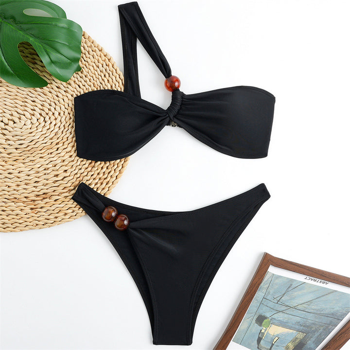 Women's bikini set with asymmetric halter neck and decorative pants buttons Mune Fashion
