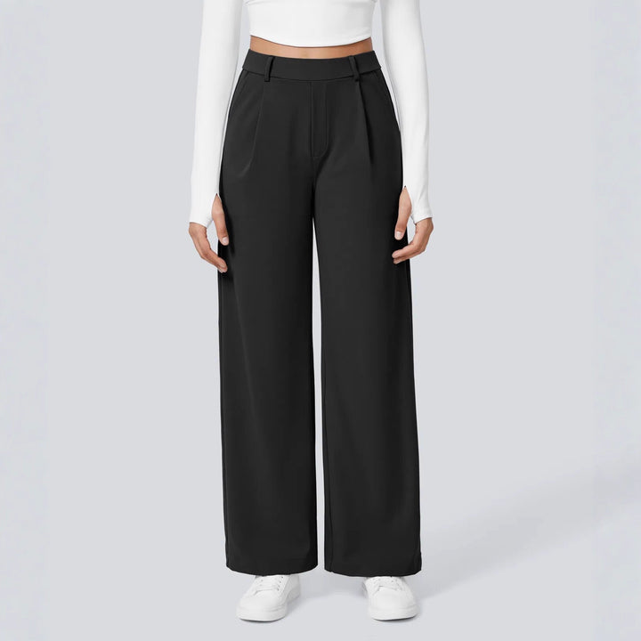 Ladies high-waisted pleated trousers with wide leg, belt loops and side pockets Mune Fashion