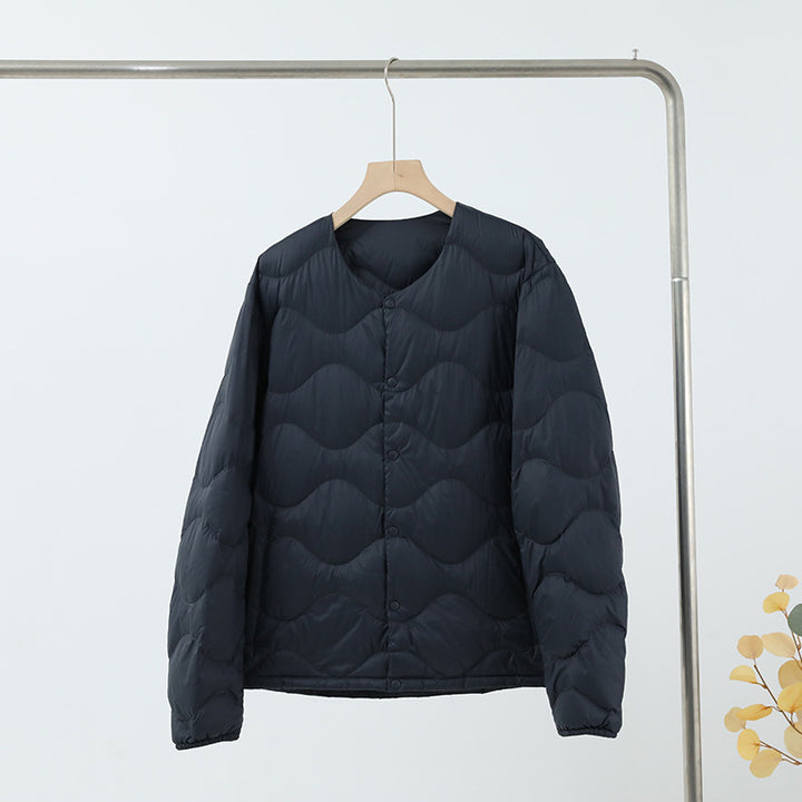 Women’s sleeveless thermal quilted vest with wave-shaped quilting and snap button closure Mune Fashion
