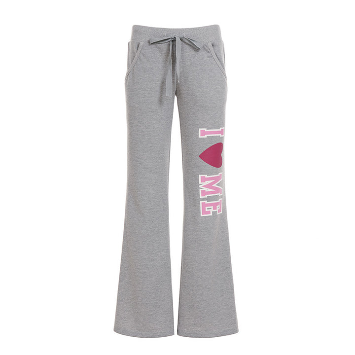 Women's soft flared jogging pants with drawstring, side pockets, and eye-catching Love print Mune Fashion