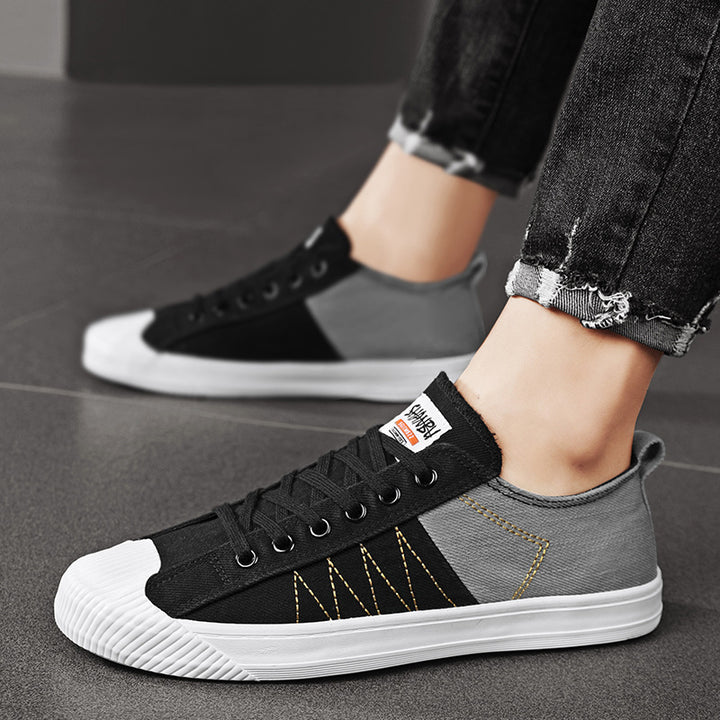 Unisex low canvas sneakers with reinforced rubber toe cap and contrasting textile panels Mune Fashion