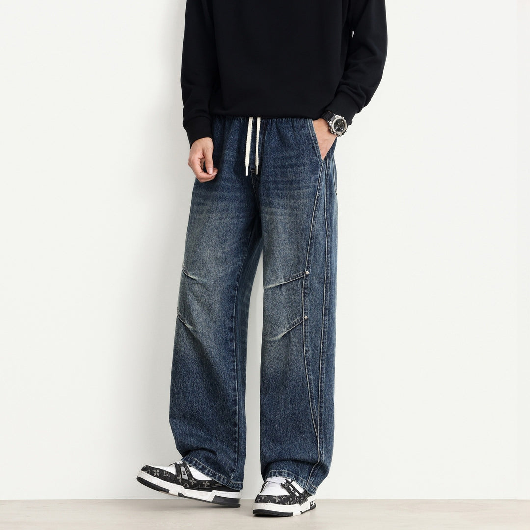 Men's Loose Fit Denim Pants with Drawstring Waistband, Panel Seams and Used Wash Mune Fashion