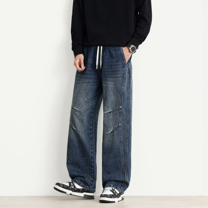 Men's Loose Fit Denim Pants with Drawstring Waistband, Panel Seams and Used Wash Mune Fashion