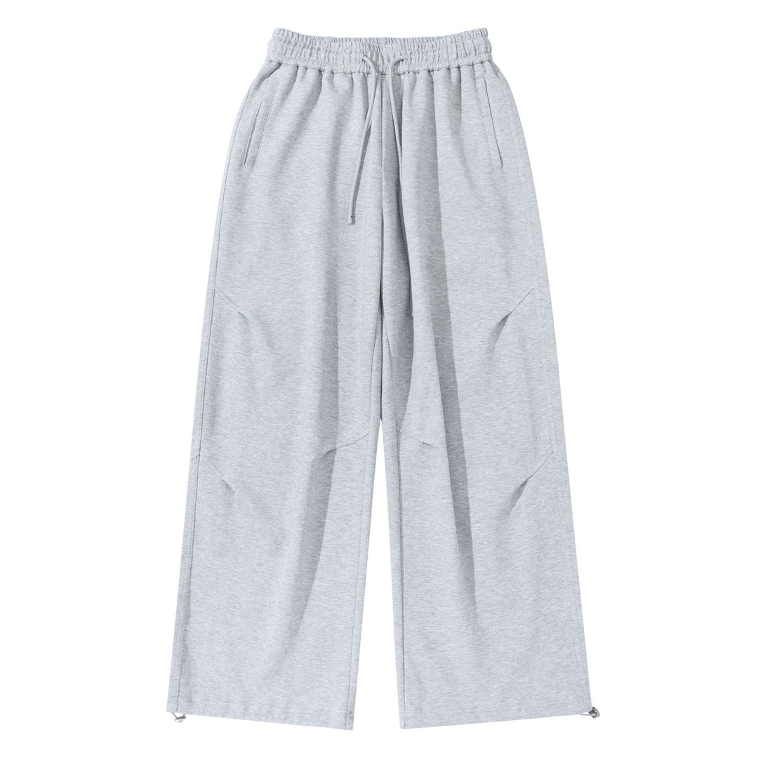 Unisex Wide French-Terry Sweatpants with elastic drawstring waistband, side pockets, and adjustable hem.