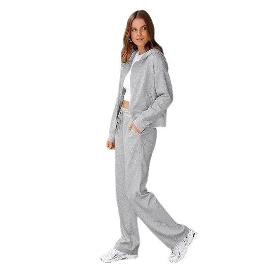 Women's two-piece lounge set with hooded jacket, zipper, and wide high-waisted pants made of sweat fabric Mune Fashion