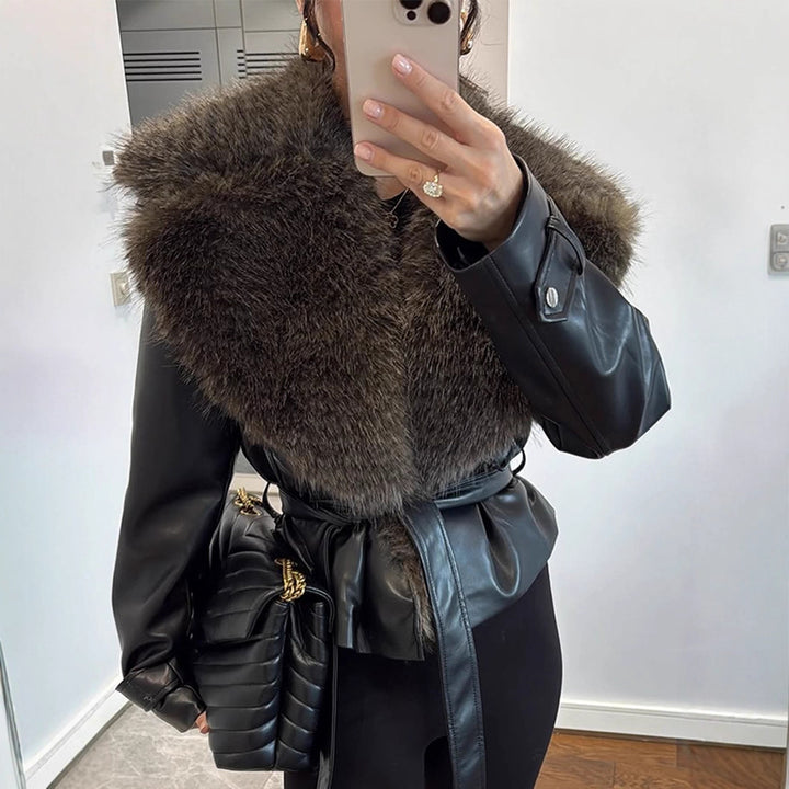 Women's tailored faux leather jacket with voluminous faux fur shawl collar and tie belt Mune Fashion