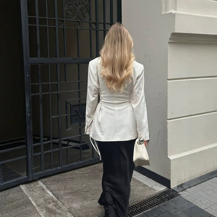 Women's tailored blazer with deep V-neck, zipper front and drawstring detail Mune Fashion