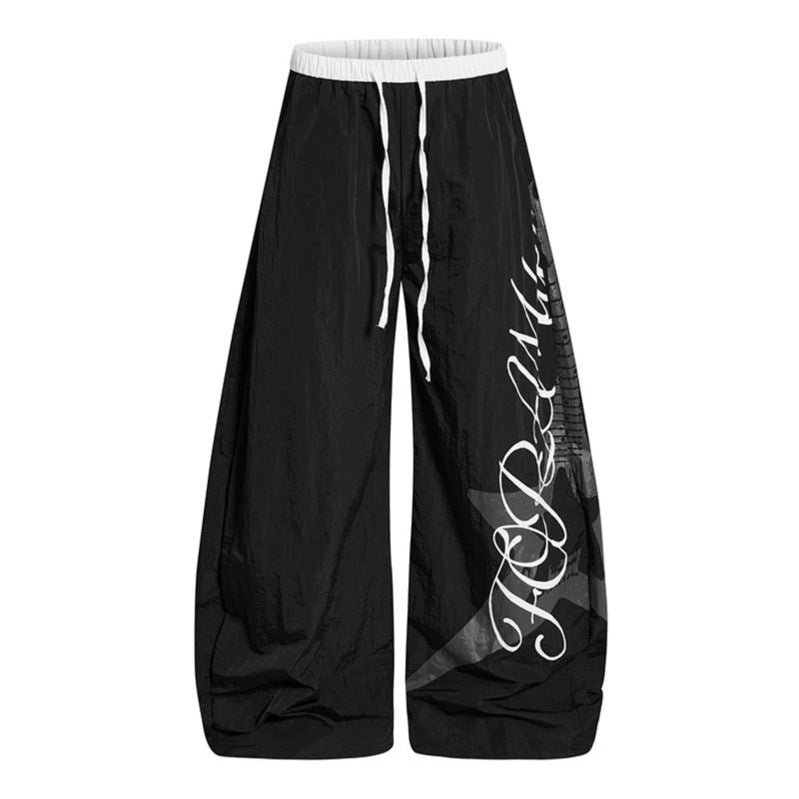 Women's Wide Palazzo Trousers with Drawstring Waist and Large Statement Print Mune Fashion