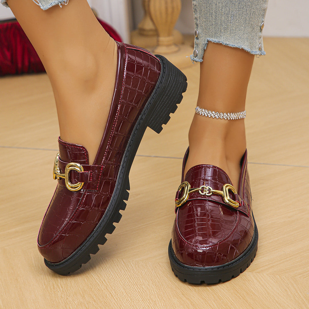 Women's loafers with glossy crocodile embossing, featuring a profiled tractor sole and golden decorative buckle Mune Fashion