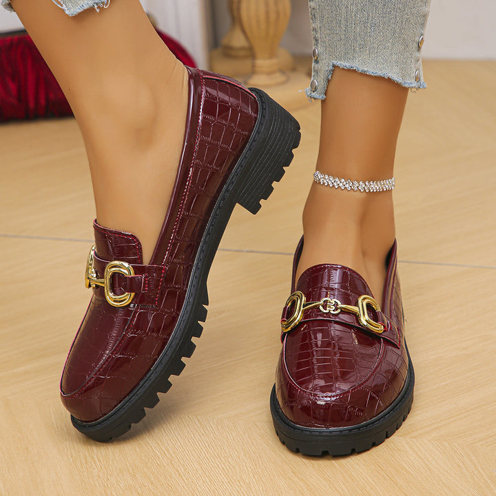 Women's loafers with glossy crocodile embossing, featuring a profiled tractor sole and golden decorative buckle Mune Fashion