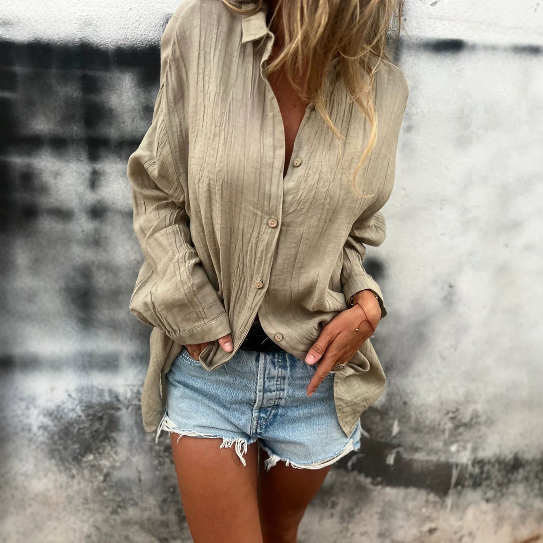 Women's casual oversized tunic shirt with linen texture, wood button placket, and elongated hem Mune Fashion