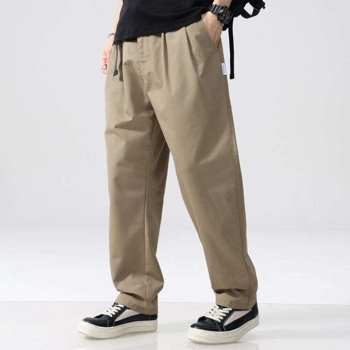 Men's relaxed fit pleated pants with drawstring and wide leg Mune Fashion