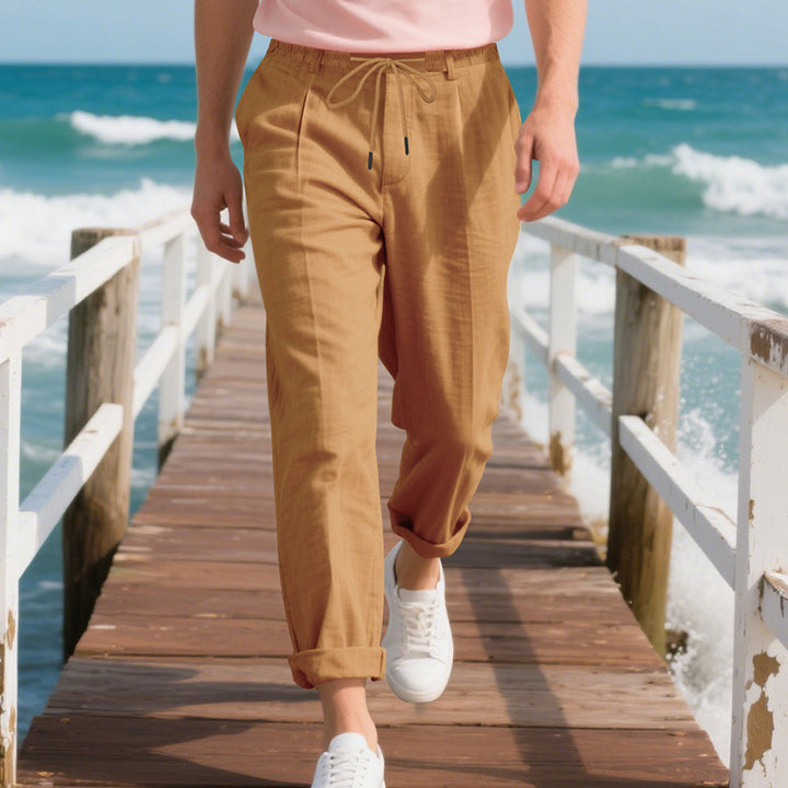 Men's beach-suitable linen blend lounge pants with elastic drawstring, subtle pleat, and rolled ankle hem Mune Fashion