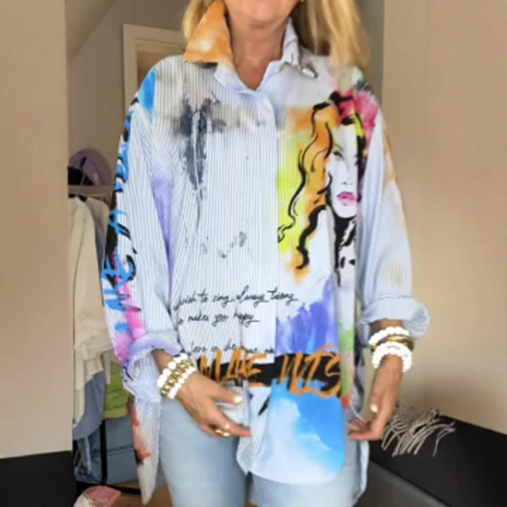 Ladies loose-fitting shirt blouse with artistic graffiti print, fine pinstripe texture and extended hem Mune Fashion