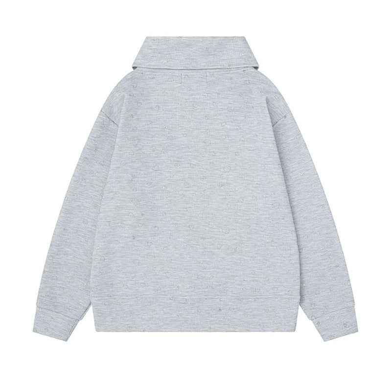 Women’s oversized sweatshirt with asymmetrical stand-up collar, kangaroo pocket and musical heart embroidery Mune Fashion