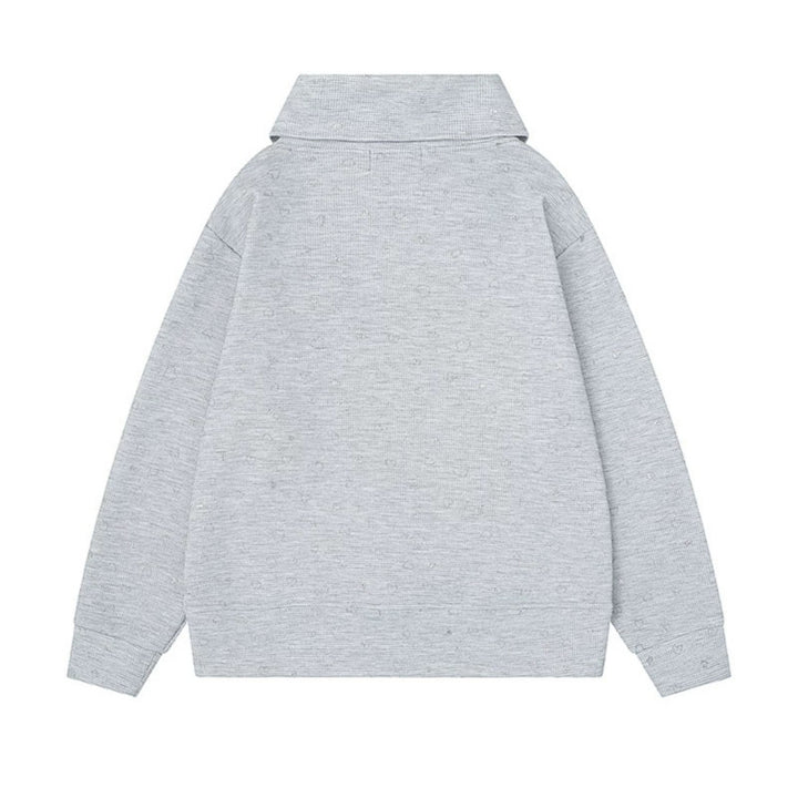 Women’s oversized sweatshirt with asymmetrical stand-up collar, kangaroo pocket and musical heart embroidery Mune Fashion