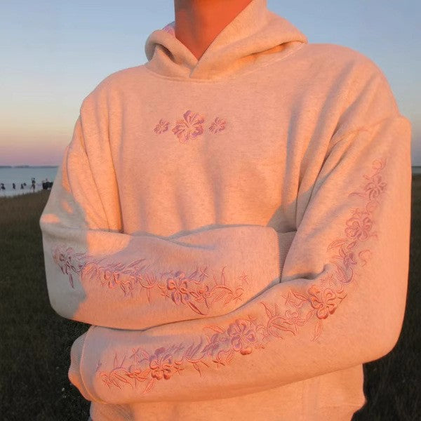 Women's hooded sweatshirt with floral embroidery and printed hood lining Mune Fashion