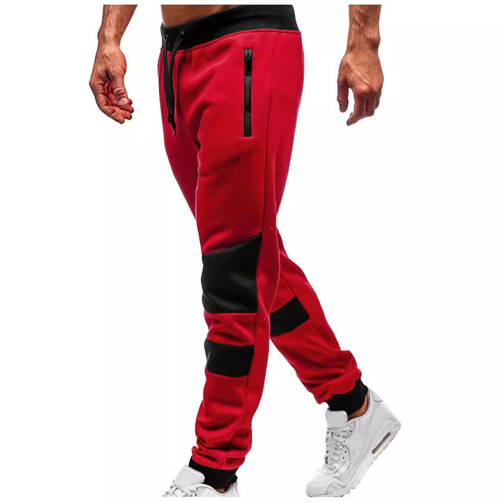 Men's slim-fit jogging pants with zip pockets, elastic comfort waistband, and reinforced knee panels Mune Fashion