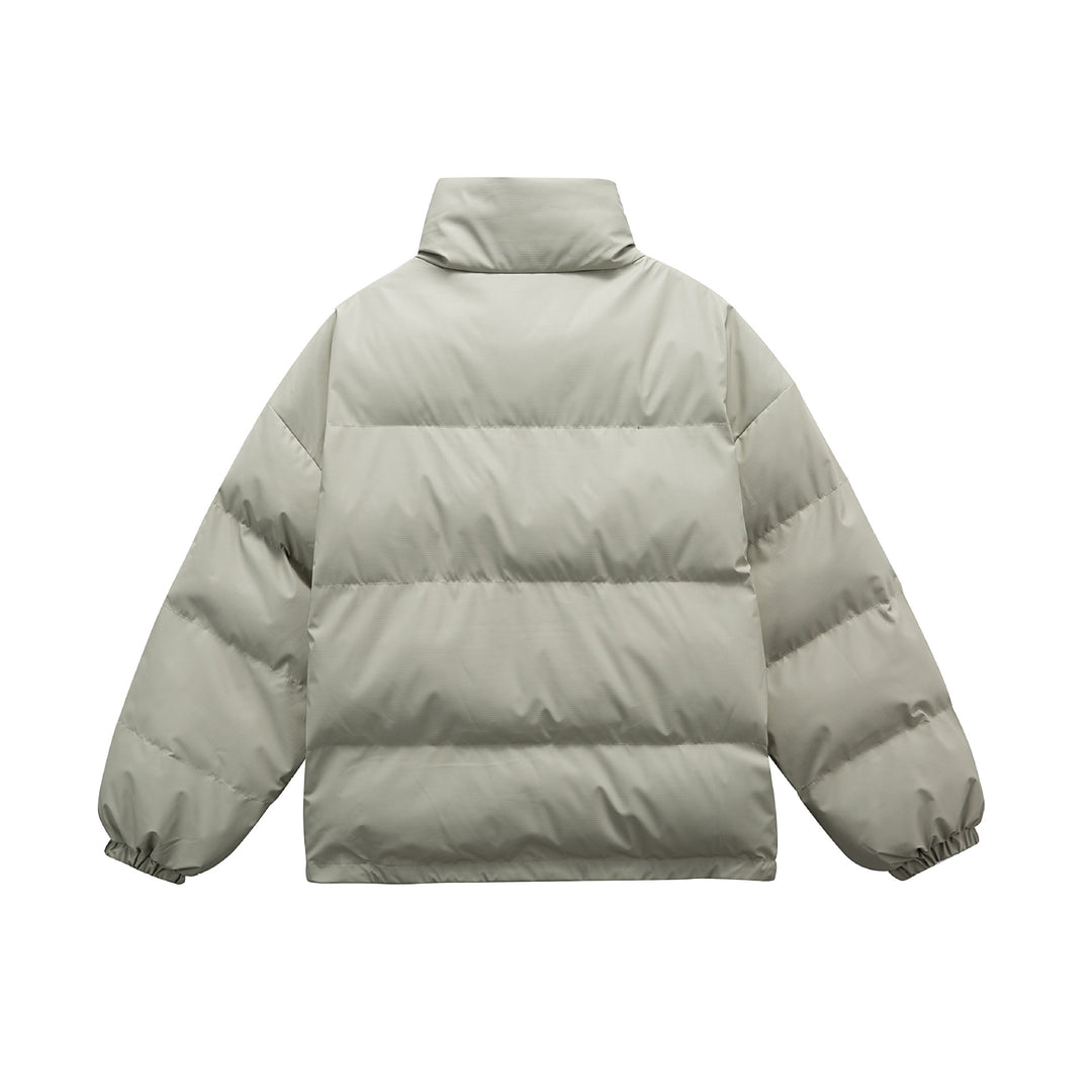 Unisex Boxy padded oversized puffer jacket with stand-up collar and statement patch details Mune Fashion