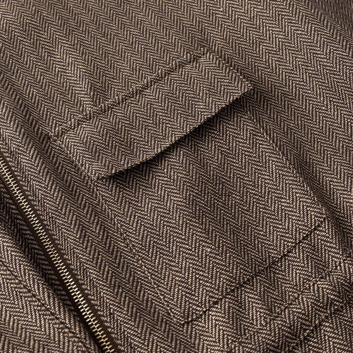 Women's short-sleeved tailored transition jacket with zipper, drawstring, and patch chest pockets Mune Fashion